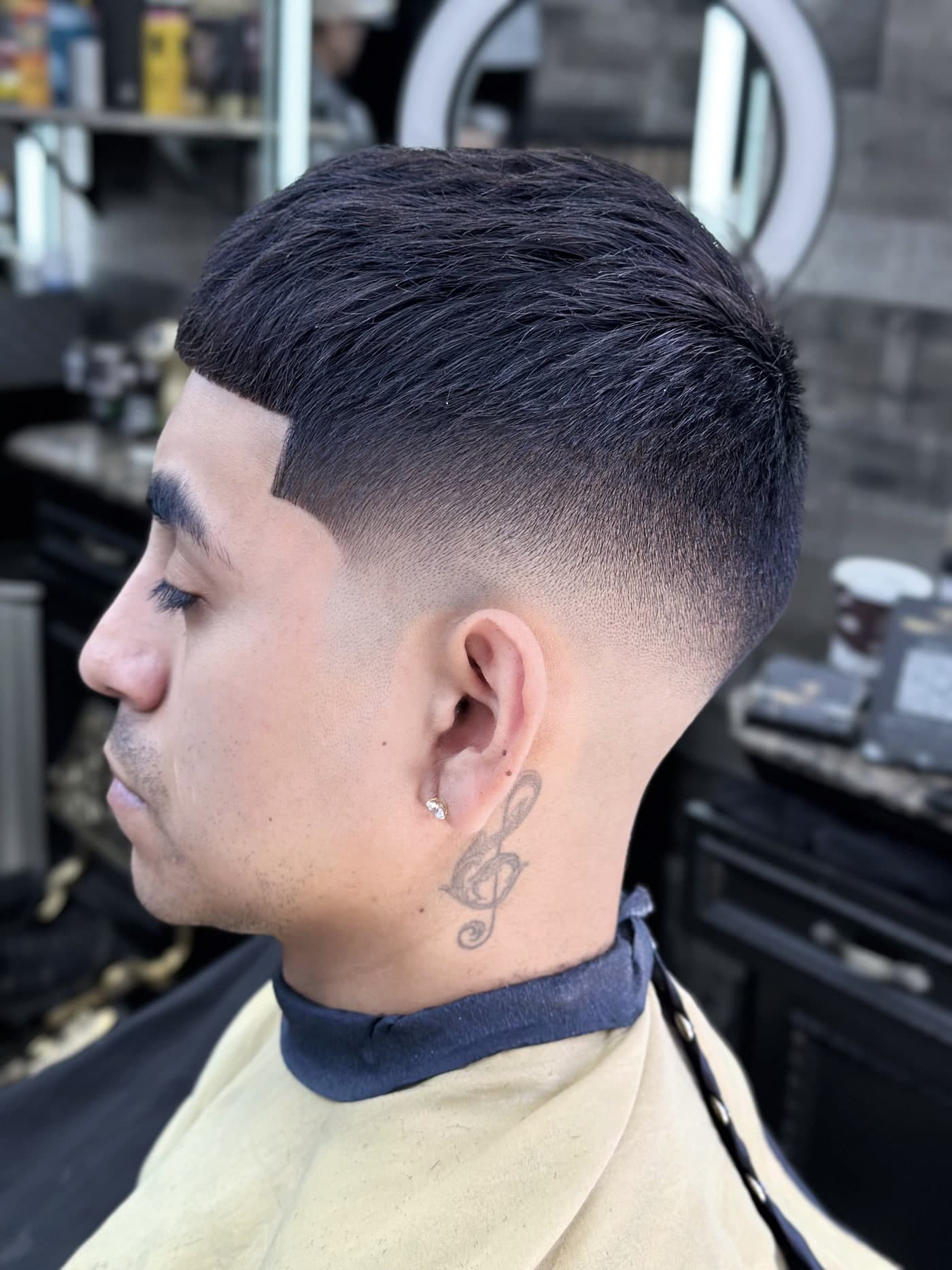 Crisp low fade haircut by Traggocuts